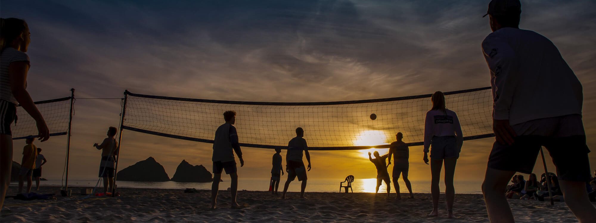 volleyball sunset 2000x750 - People...